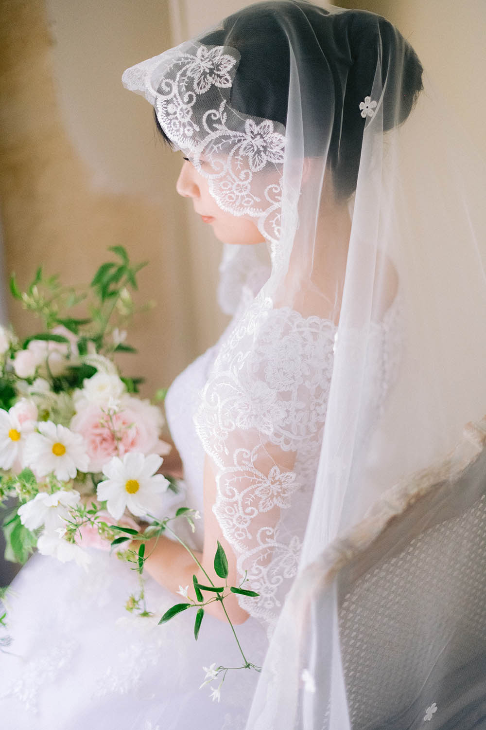 bride face the window during getting ready